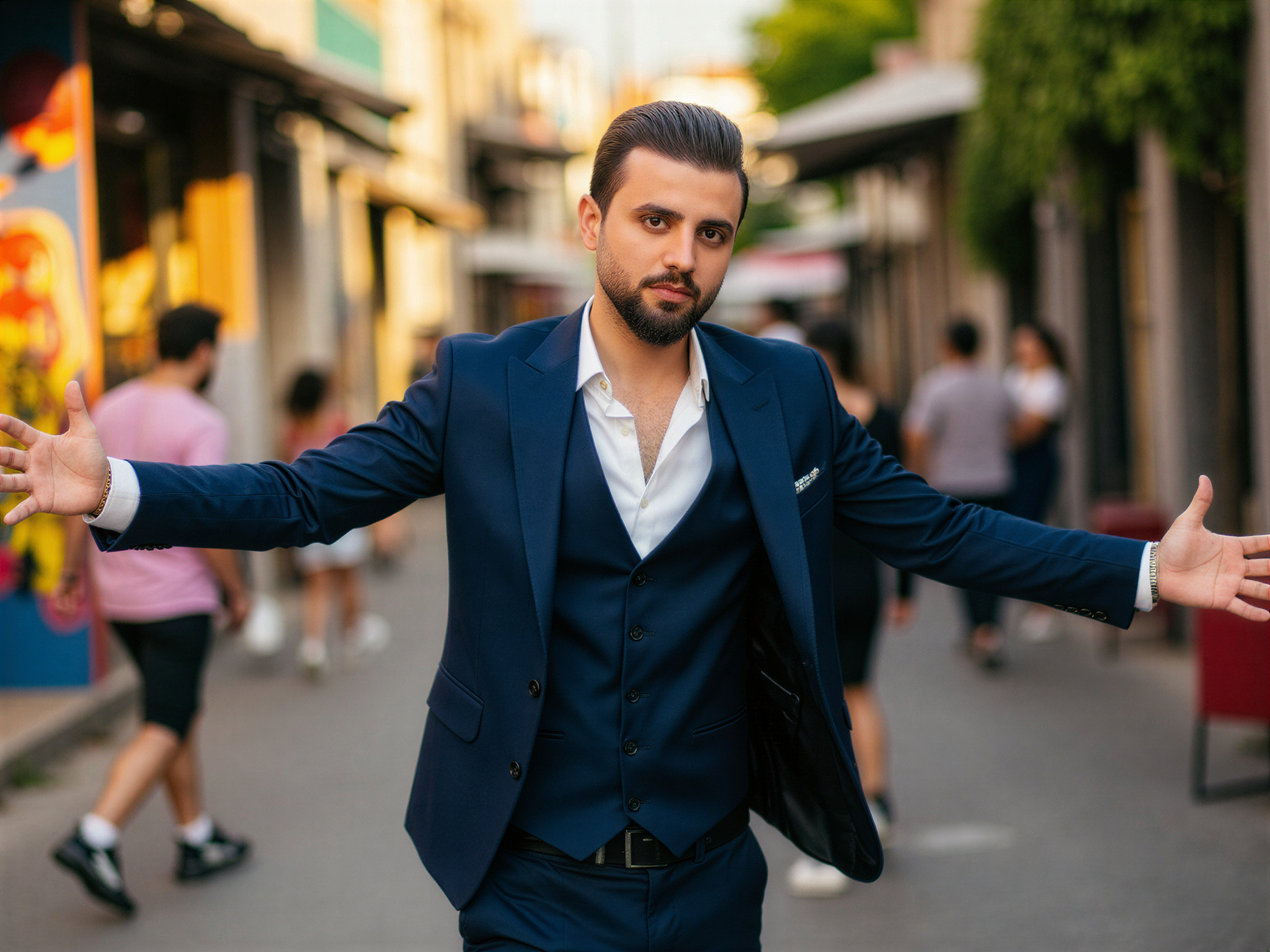 A joyful male individual, OD62S, aged 32, captured in a vibrant street scene in São Paulo. He is dressed in a sleek, tailored navy suit paired with a crisp white shirt, the top button casually undone. The dynamic backdrop features colorful street art and bustling life, reflecting the city's energy. He stands with arms outstretched, exuding happiness and confidence, a broad smile lighting up his face as the sunlight filters through the vibrant urban landscape. The mood is celebratory, encapsulating the spirit of São Paulo in a photorealistic style with warm, natural lighting.