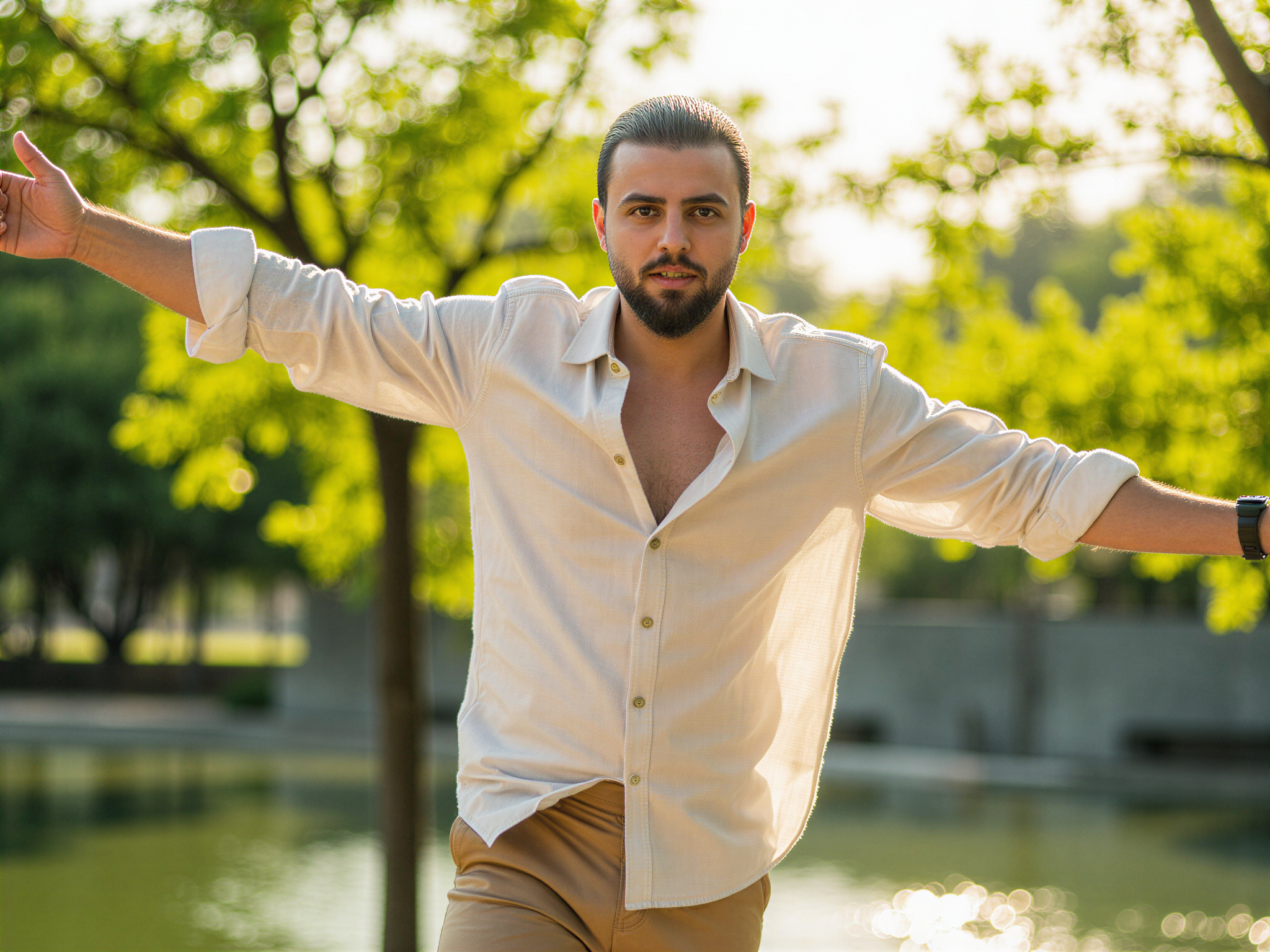 A joyful male figure, OD62S, aged 32, captured in a vibrant, candid moment at Ibirapuera Park in São Paulo. He wears a stylish linen shirt, rolled at the sleeves, and tailored shorts, evoking a relaxed summer vibe. Sunlight filters through the lush green trees, casting playful dapples of light across his face, highlighting the happiness in his expression. His body language is open and inviting, with arms slightly raised as if celebrating the beauty of the day. The serene lake and modernist architecture of the park frame the composition beautifully, integrating an atmosphere of joy and vitality, perfect for a lifestyle editorial.