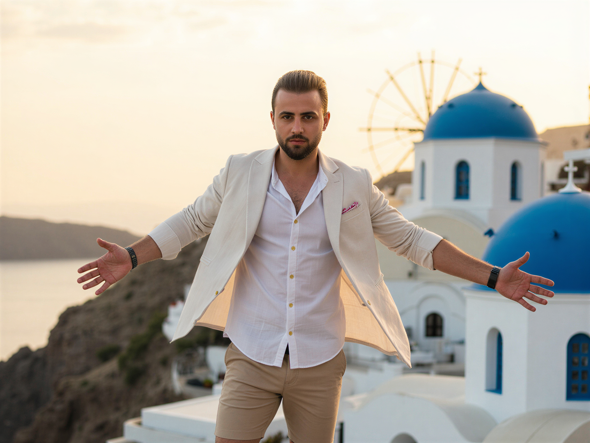 A joyful male figure, OD62S, aged 32, standing on the iconic cliffside of Oia, Santorini, with the stunning blue dome churches and the Aegean Sea serving as a breathtaking backdrop. He is dressed in a light linen shirt and tailored shorts, exuding effortless Mediterranean chic. The sun casts a warm golden glow on his features, capturing the essence of a carefree summer day. His arms are open wide in a celebratory gesture, and his genuine smile lights up the scene, reflecting the vibrant and enchanting atmosphere of Santorini. The composition embraces the rule of thirds, highlighting both the subject and the picturesque landscape, creating an image filled with happiness and wanderlust.