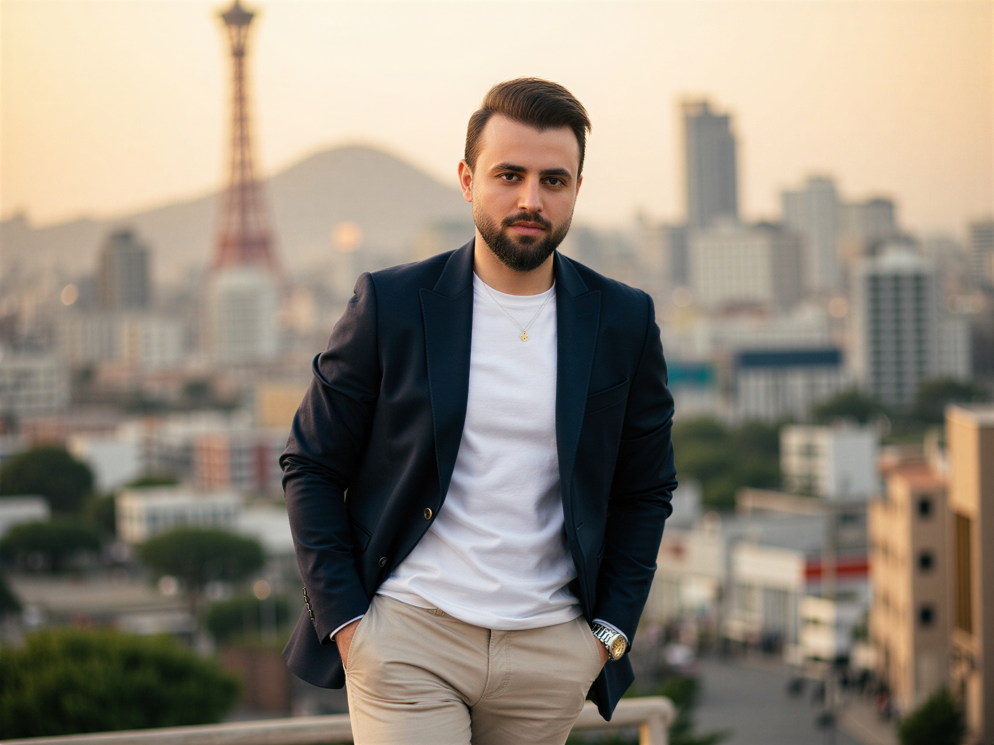 A vibrant portrait of a 32-year-old male, OD62S, radiating joy against the dynamic backdrop of Seoul's colorful cityscape. He is dressed in a tailored, lightweight navy blazer over a crisp white t-shirt, paired with slim-fit chinos, embodying modern urban chic. The mood is exuberant as he smiles broadly, with the iconic Namsan Tower and bustling streets of Seoul in soft focus behind him. Warm, golden-hour lighting bathes the scene, creating a cheerful and inviting atmosphere, perfectly encapsulating a sense of happiness and urban energy.